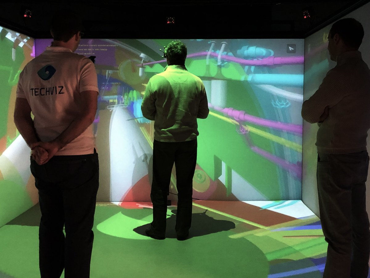 3-people-in-virtual-reality-immersed-in-a-complex-3D-model-in-a-VR-CAVE