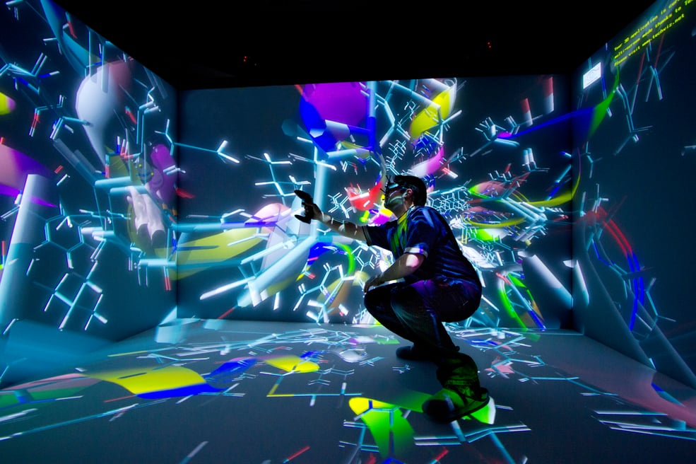 man visualizing data in an immersive room or CAVE