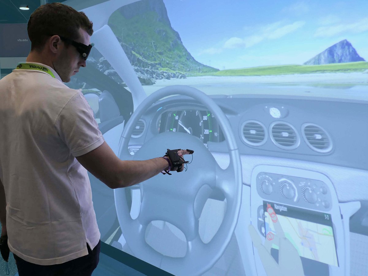 techviz-engineer-touching-a-2D-interface-in-the-3D-model-of-a-car-cockpit-with-ART-finger-tracking-device-on-his-hands