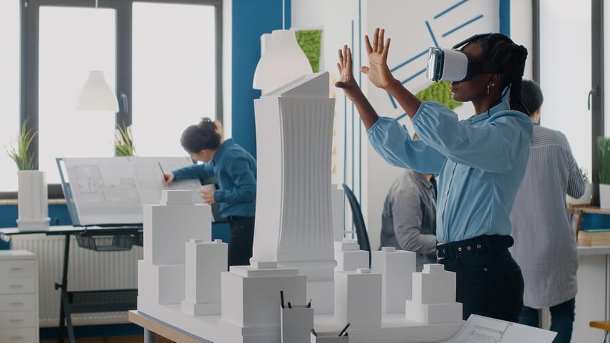 female-architect-using-vr-headset-for-an-architecture-project-woman-being-connected-to-the-metaverse-through-an-HMD