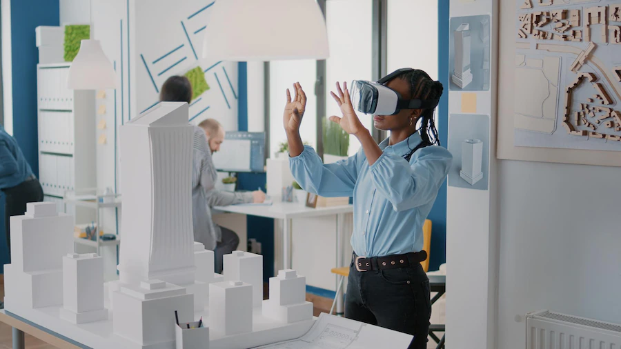 female architect using a VR headset in the metaverse to design a building with virtual reality tools